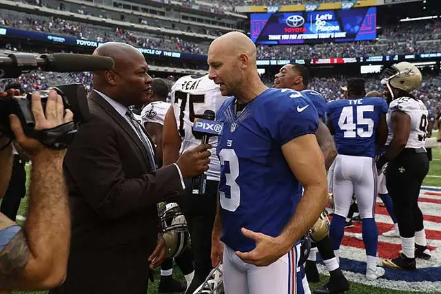 Josh Brown speaking to a sideline reporter